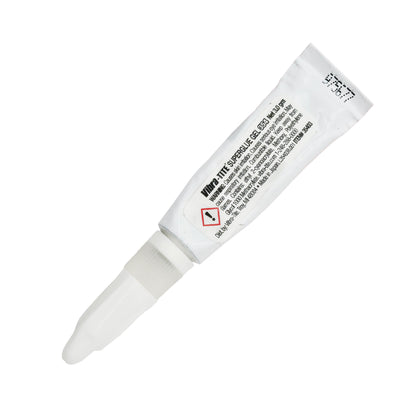 Front view of expired Vibra-Tite 354 Super Glue Gel 3g tube with white body, clear nozzle, and visible warning label text.