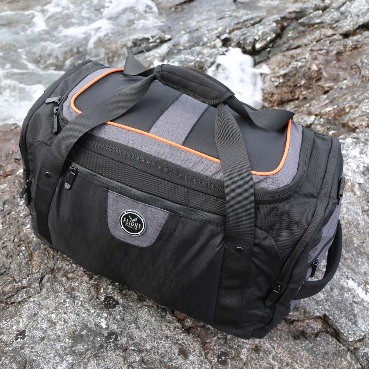 Flight Outfitters Crew Duffel Bag angled view on rocky surface