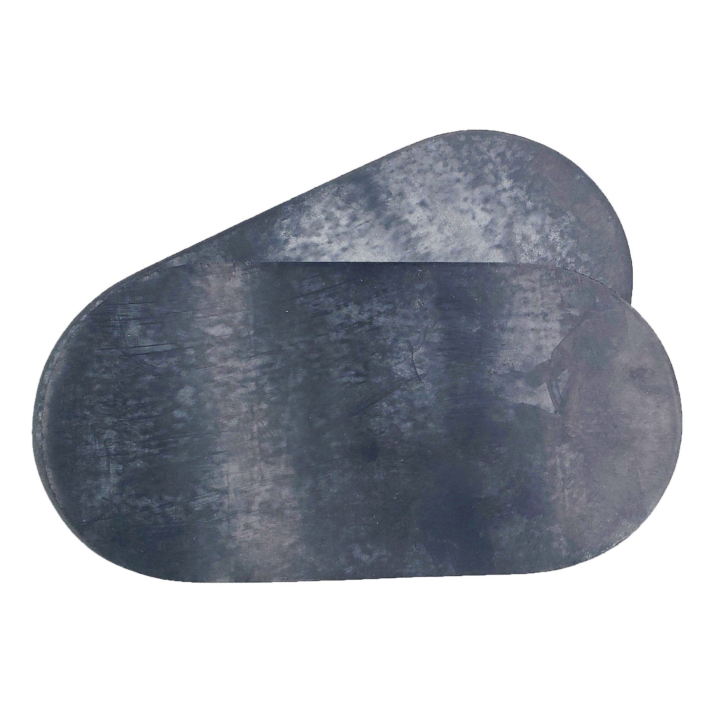 Underside of Goodrich Fastpatch large oval de-icing boot repair patches showing black textured rubber bonding surface