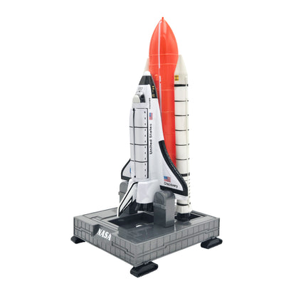 Toy Space Shuttle with external fuel tank and boosters mounted on gray NASA launch platform with crawler treads