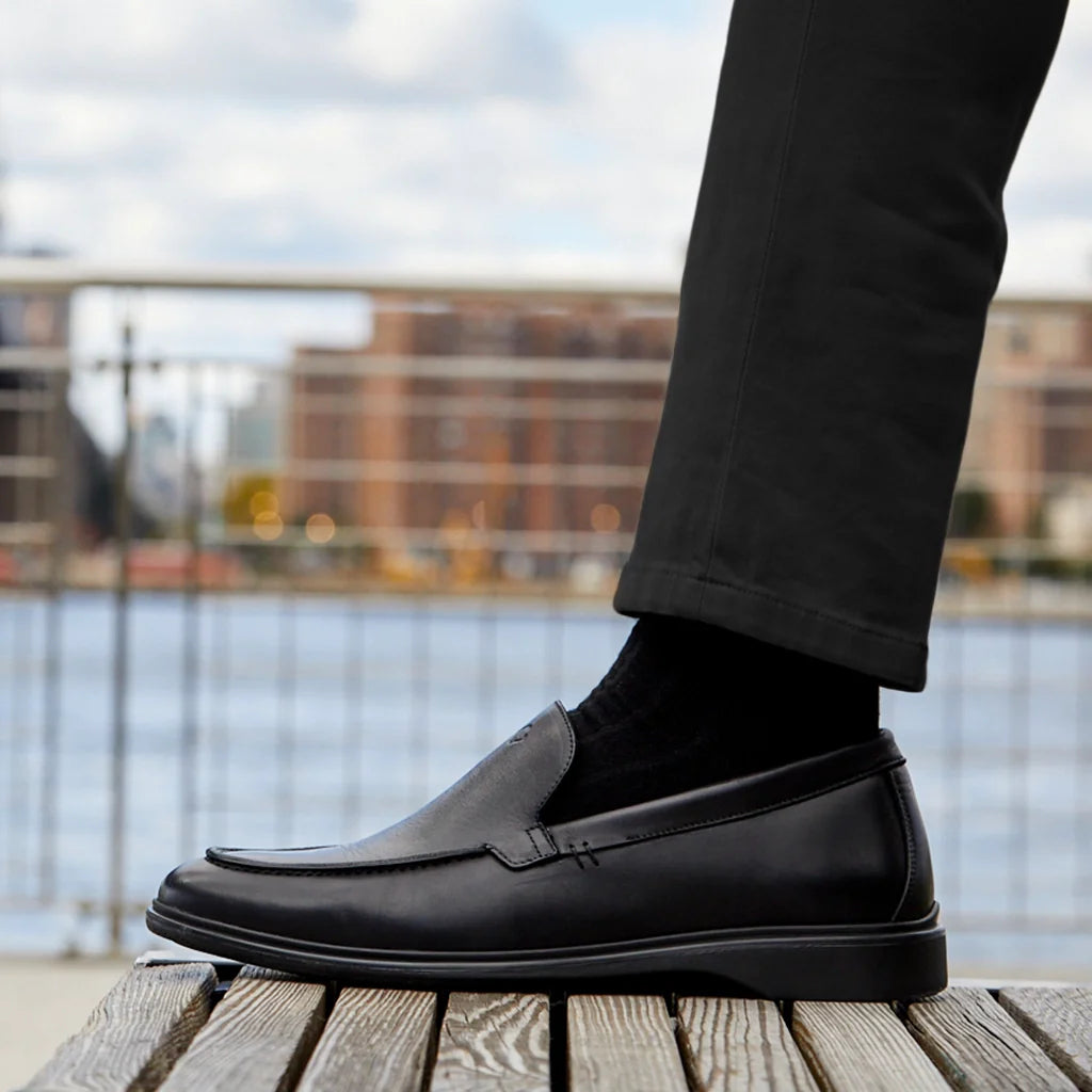 Amberjack The Loafer Obsidian black pilot dress loafer, left side view, full-grain leather slip-on | Lifestyle, Single show on bench