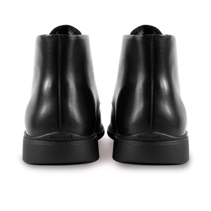 Amberjack Chukka Obsidian black pilot mid-cut boot, left side view, two-eyelet lace-up | Back