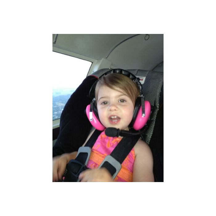 Young Girl Wearing Pilot USA PA‑1151ACG Headset in Car Seat During Flight