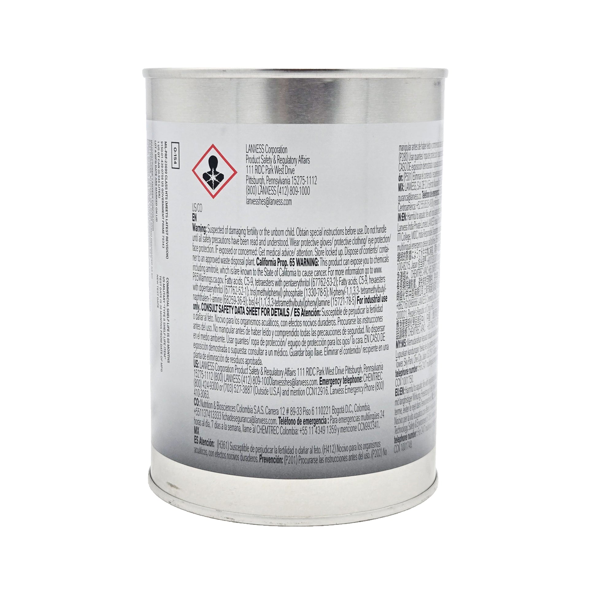 Close-up of Royco 560 turbine engine oil can label with health hazard symbol and detailed safety warnings in English and Spanish
