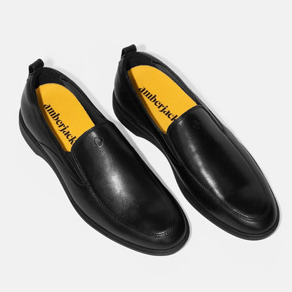 Amberjack Slip-On Obsidian black pilot dress shoe, left side view, laceless aviation shoe  | Angled Veiw