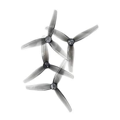 Set of four HQProp T3.5X2.5X3 grey 3-blade drone propellers in semi-transparent polycarbonate arranged on white background