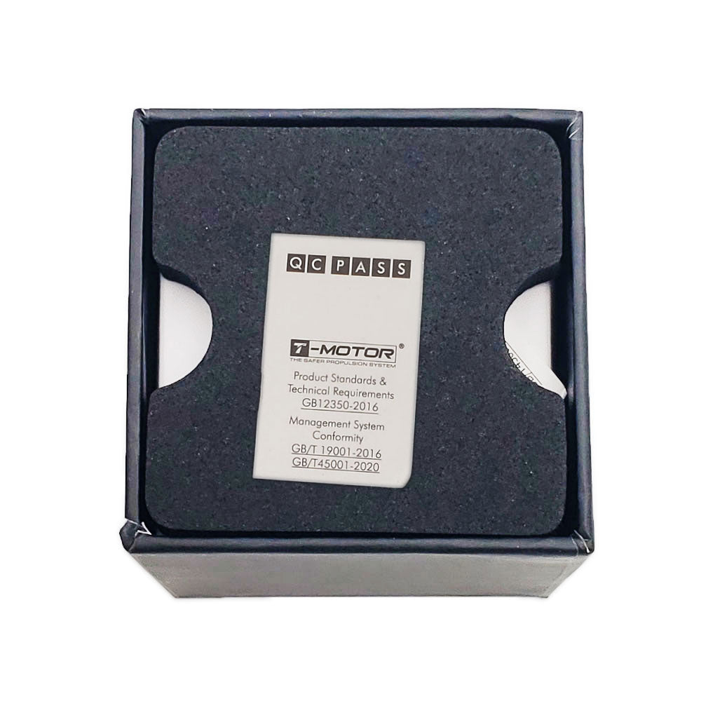 T-Motor F1000 packaging with QC pass and warranty card resting on foam insert showing conformity standards.