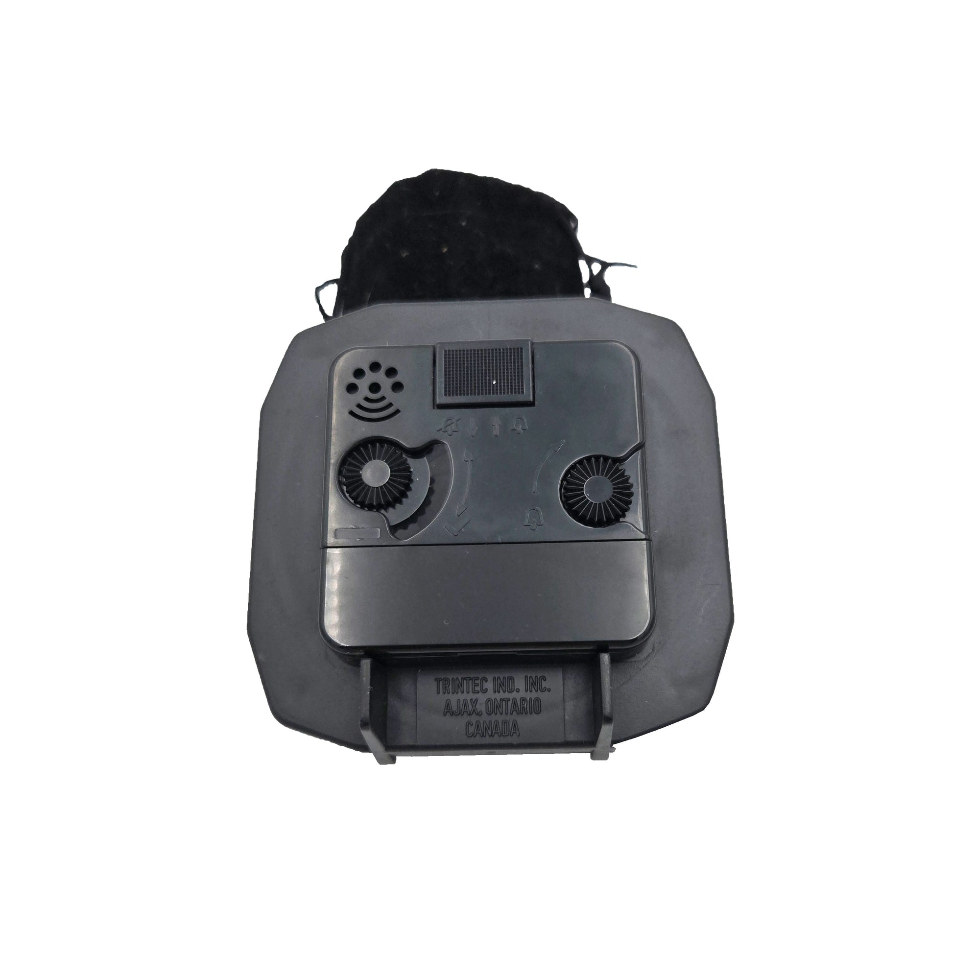 Rear view of Trintec DM65 desk alarm clock showing time and alarm adjustment knobs, on-off switch, speaker grille, and battery compartment