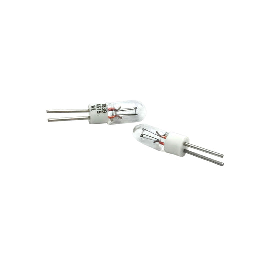 Wamco 7839AS15 subminiature aircraft lamp with clear glass bulb, white base, and twin lead wires.
