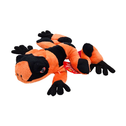 Plush frog toy with bold orange and black striped pattern and black hands and feet