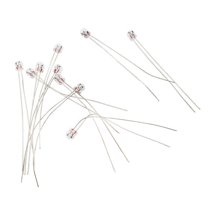 Ten Wamco 7009 subminiature aircraft lamps showing long flexible wire leads and clear glass bulbs.