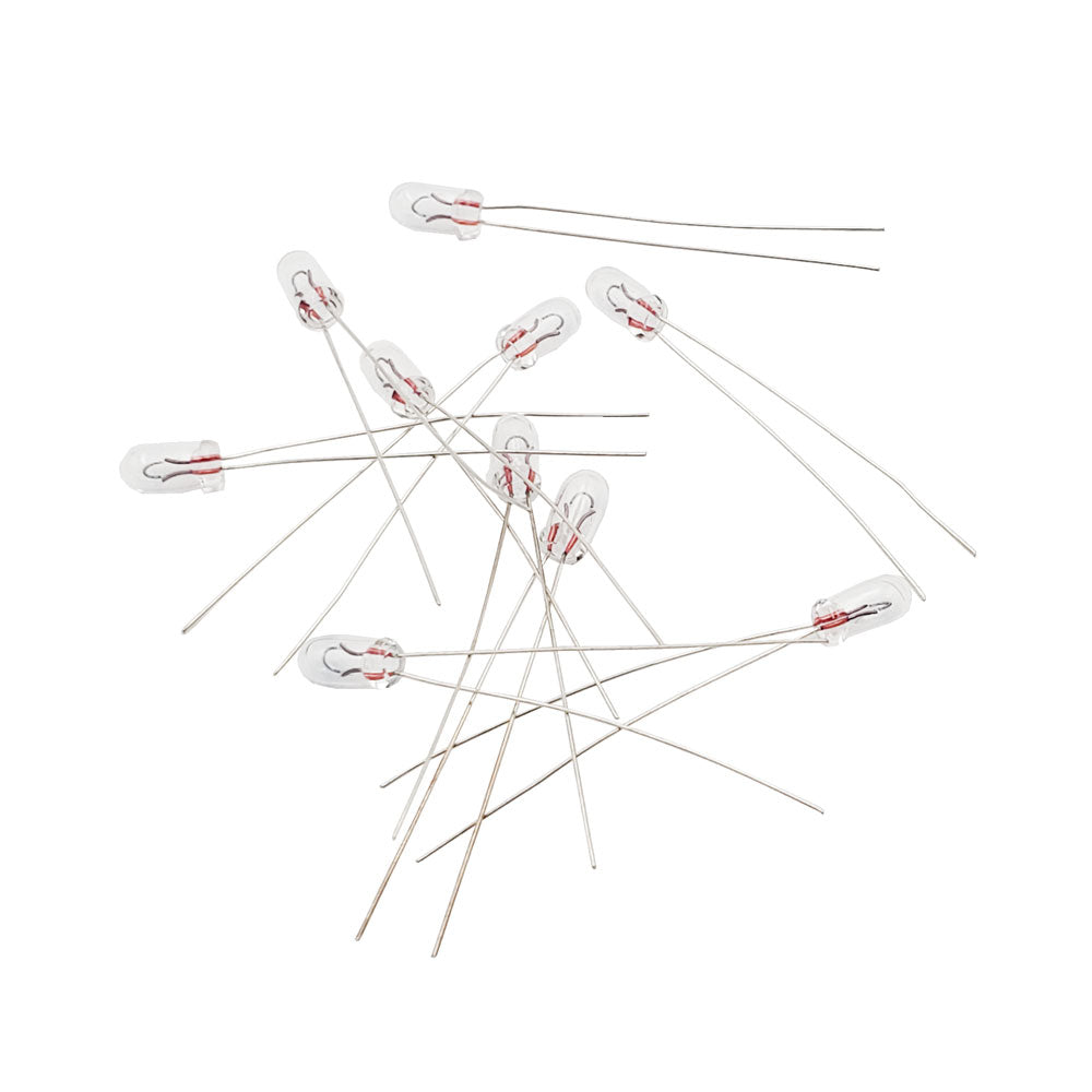 Ten Wamco WL-715 subminiature aircraft lamps with wire leads arranged on a white background
