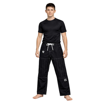 Person wearing a black martial arts uniform with white logo on a white background