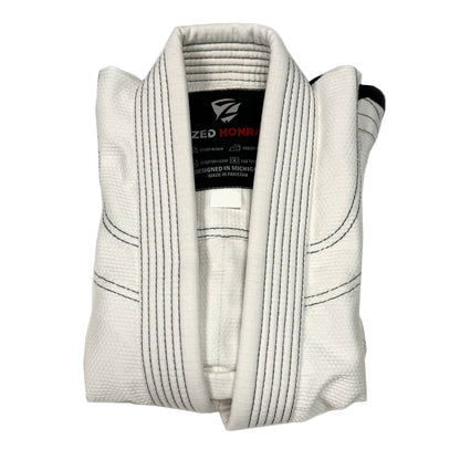 Zed Honra Youth Alpha Gi – White BJJ Kimono Jacket Neatly Folded for Storage or Display