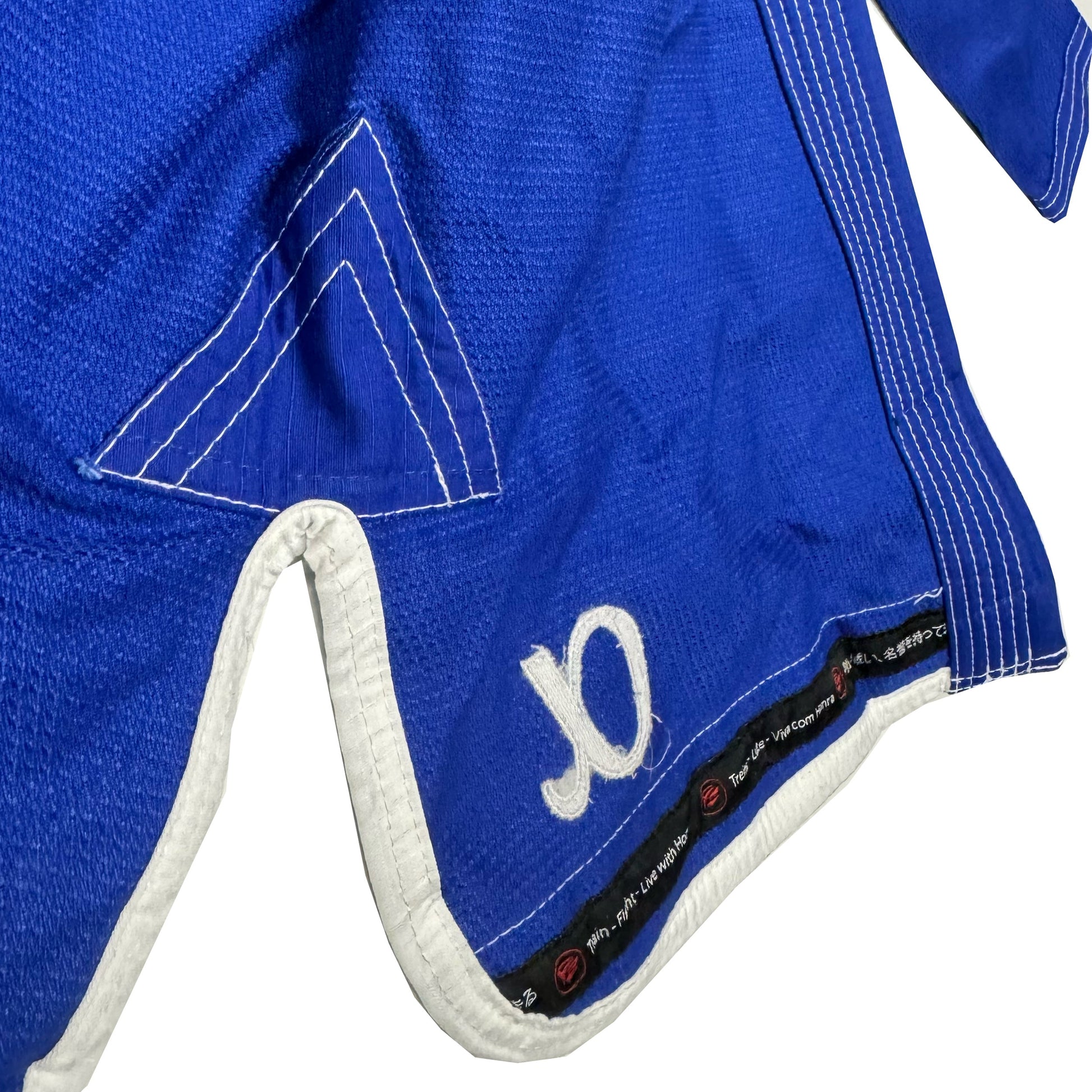 Zed Honra Women’s Alpha Gi – Inside View of Blue BJJ Kimono Showing Extra Reinforced Skirt Split