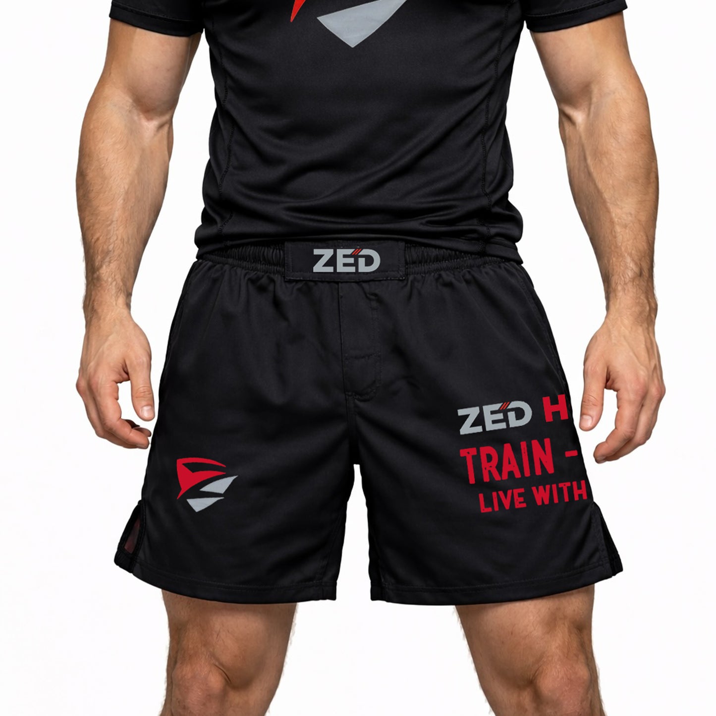 Person wearing black athletic shorts and shirt with 'ZED' branding on a white background