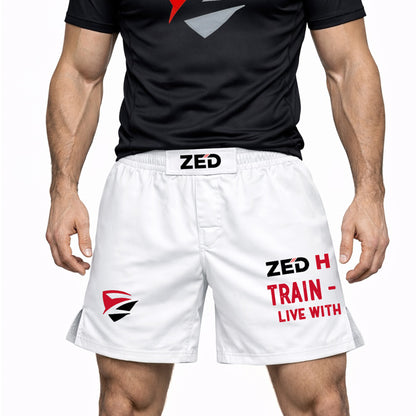 Person wearing black t-shirt and white shorts with ZED branding on a white background