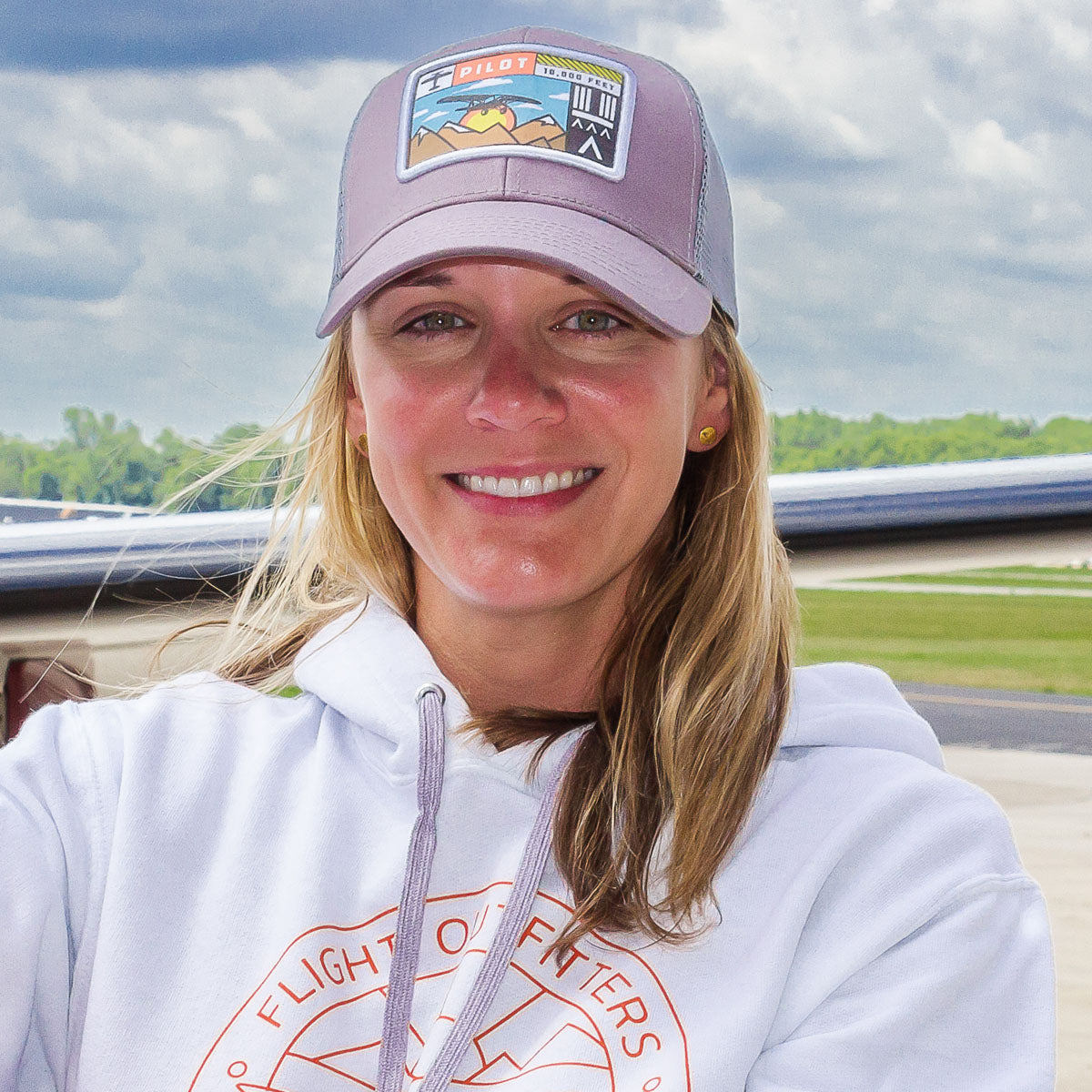 Woman wearing Flight Outfitters Adventure Hat, demonstrating fit and style for pilots and outdoor enthusiasts