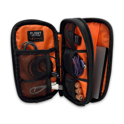Flight Outfitters Cord Organizer holding charging cables and electronics
