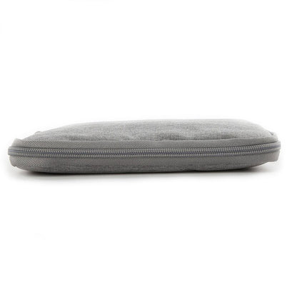 Slim profile of the zippered travel watch and strap organizer pouch lying flat.