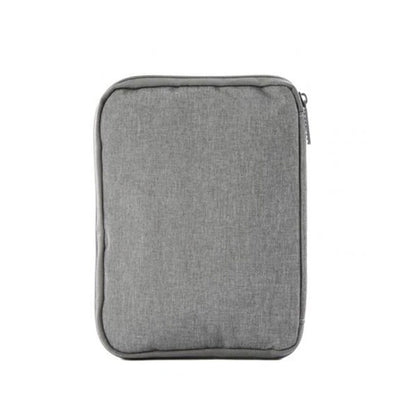 Top view of the travel watch and strap organizer pouch with a minimalist gray fabric exterior.