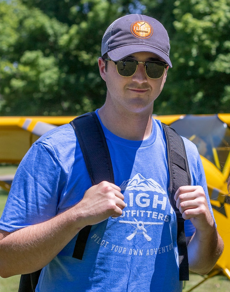 A man wearing the Flight Outfitters Mountain Range T-Shirt, showcasing its comfortable and versatile fit.