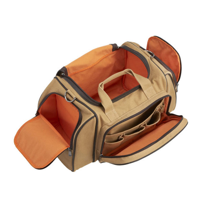 Flight Outfitters Bush Pilot Duffel Bag with all zippers open, revealing the bright orange interior and organized compartments.