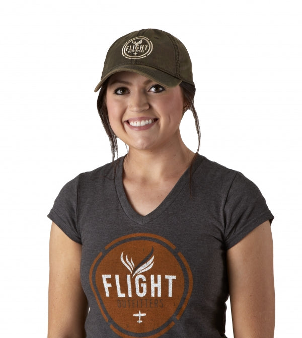A woman wearing the Flight Outfitters Women's Vintage V-Neck T-Shirt, highlighting its comfortable fit and retro style.