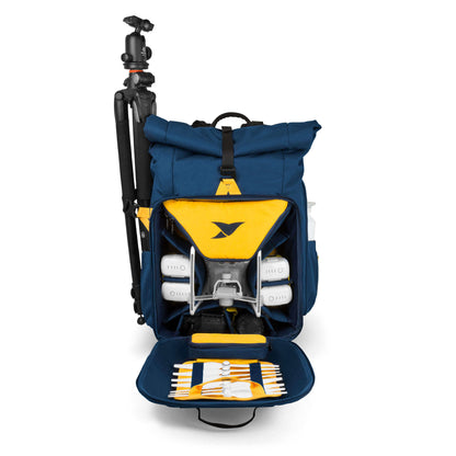Staged Front View of Torvol Drone Adventure Backpack with Front Pocket Open Displaying Model Parts and Tripod Attached