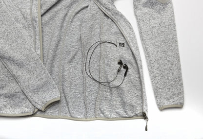 Interior view of the Fairbanks Fleece’s pocket with a pass-through headphone cable port for hands-free convenience.